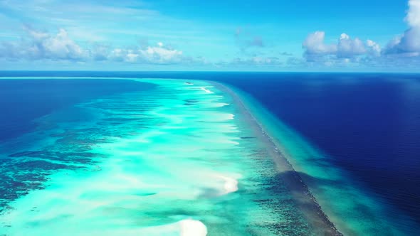 Aerial above scenery of exotic lagoon beach break by turquoise water with white sand background of a