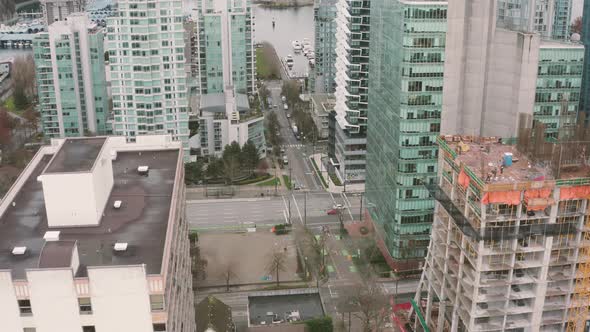Aerial view of condo towers by the harbour in downtown Vancouver.