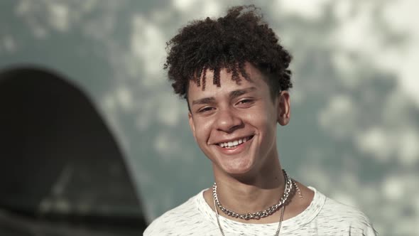 Portrait of Happy Latin Teenager Boy Smiling Laughing and Looking at Camera with Positive Emotion