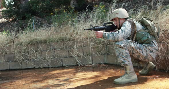 Military soldier during training exercise with weapon