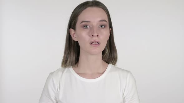 Young Woman Shaking Head To Deny on White Background