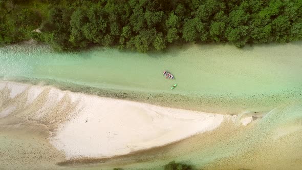 Aerial view of whitewater kayaker paddling on the Soca river, Slovenia.