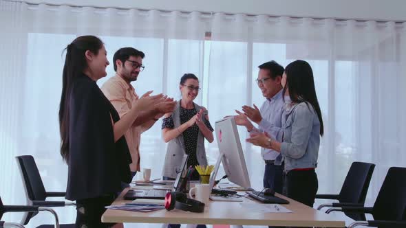 Successful Business People Celebrating Project Success at Office