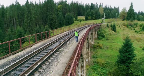 Aerial Shot Construction Worker on Railways alt