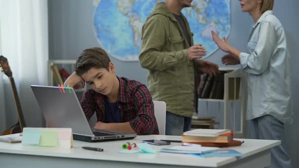 Annoyed Parents Quarreling Behind Sad Childs Back