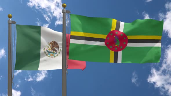 Mexico Flag Vs Dominica Flag On Flagpole