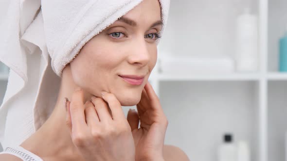 Closeup Face of Girl Touching Groomed Moisturizing Skin