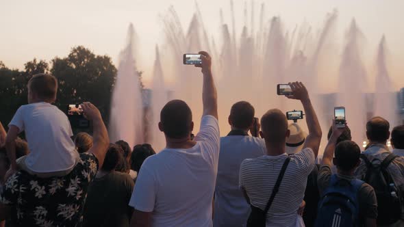 Crowd Taking Pictures with Cell Phones, Fountains in Barcelona, Event. A Crowd Taking Pictures with