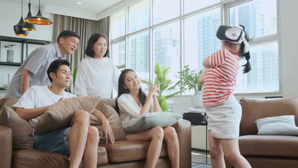 happiness asian family multi age enjoy watch cheering her daughter playing vr goggle