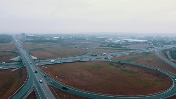 Aerial View of Road Junction with Moving Cars