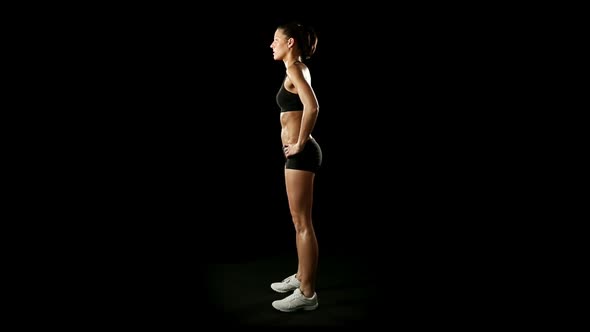 Young Athletic Woman Wearing Sporstwear is Exercising Slow Motion