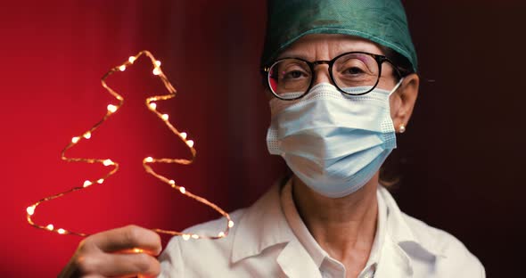 Female Doctor Celebrates Christmas