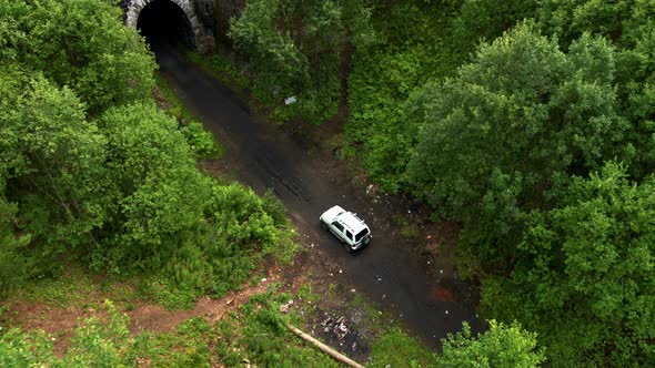 Aerial View of the Car Entering the Tunnel