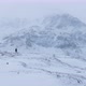 Solo mountaineer caught up in a strong blizzard on a winter day - VideoHive Item for Sale