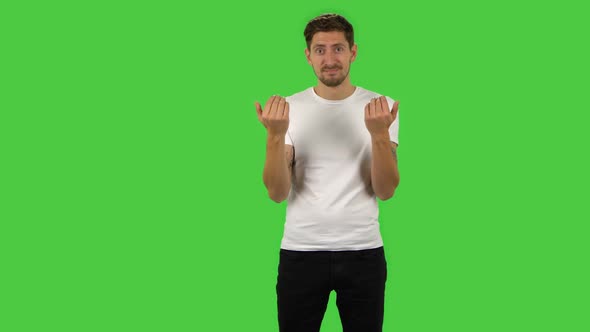 Confident Guy Is Waving Hand and Showing Gesture Come Here. Green Screen