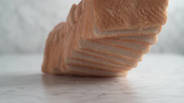 Sliced white bread falling. Slow Motion.