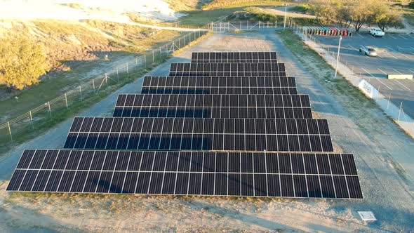 Aerial view of a small solar panel farm built close to a remote coastal area