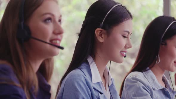 Customer Support Agent or Call Center with Headset Talking to Customer on Phone