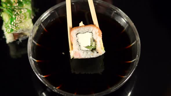 Chopsticks to Dip the Rolls in Soy Sauce Closeup