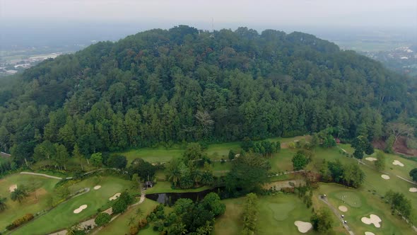 Golf course at foot of tropical forest at Tidar hill Magelang, Java, Indonesia