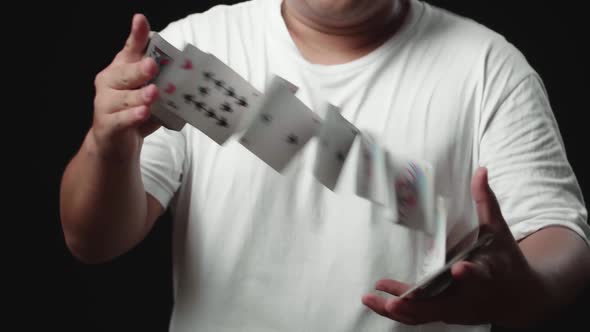 Magician Does Card Trick Throwing Deck From One Hand To Another