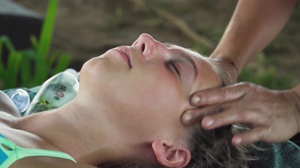 Woman Doing Massage to Girl in Asia