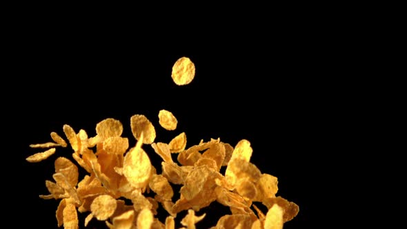 Super Slow Motion Cornflakes Take Off Against a Black Background