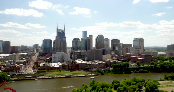 Nashville, Tennessee skyline with drone video moving down.