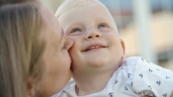 Mother Kissing Toddler