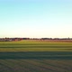 Aerial Cinematic Clip Drone Flying Over a Farm Field During Sunset - VideoHive Item for Sale