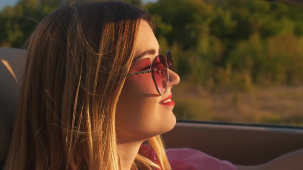 Woman Driving Her Convertible Car