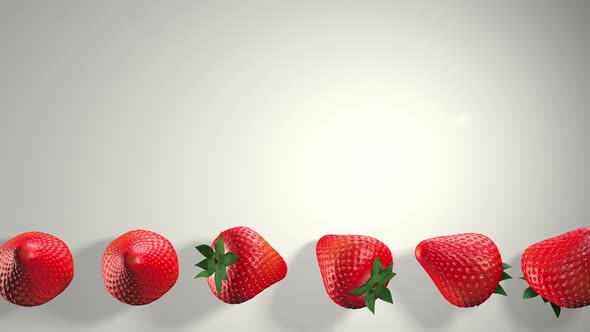 Fresh strawberries with green leaves on a white background