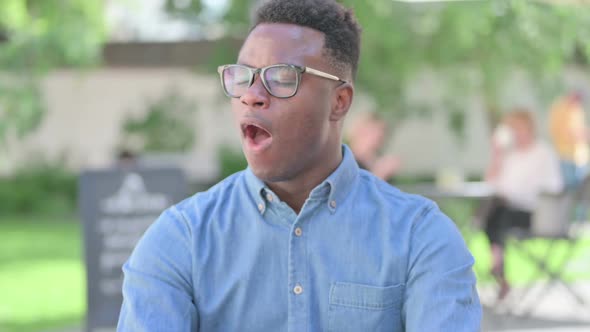 Portrait of Sleeping African Man Yawning