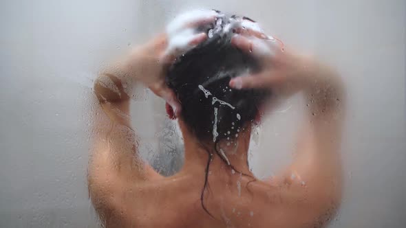 Woman Washing Her Hair with Shampoo