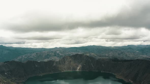 Quilotoa Volcanic Crater Lake Lagoon Near Quito, Ecuador - aerial descending