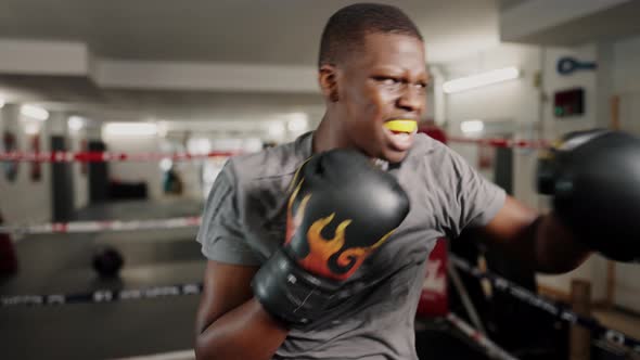 Young Tired African Male Kickboxer During Boxing Training at Gym Fight Club