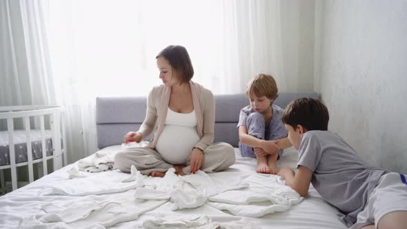 Pregnant Woman Sits Bed Two Sons Prepares Things Birth Child