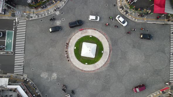 Top aerial view of Tugu Yogyakarta Landmark with busy traffic.