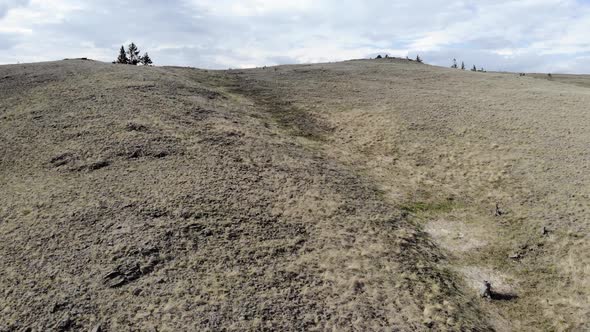 A Drone Flies Over the Ridge, Desert or Steppe Landscape