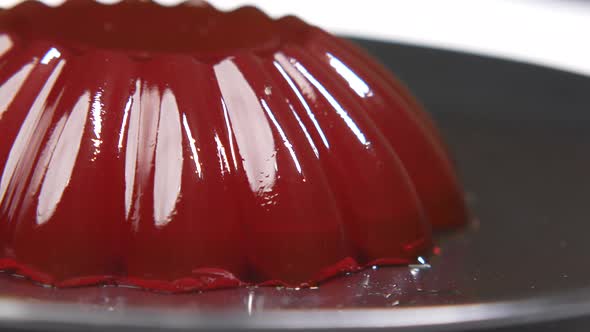 Close Up of Red Jelly on Plate on Table