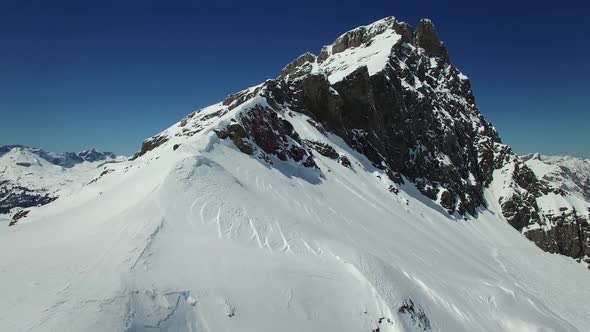 Flying over Snow Mountain Landscape