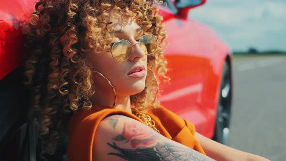 Beautiful Model Woman Tattoo Is Posing Red Car Summer Landscape