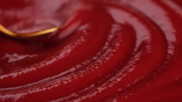 Ketchup sauce with golden spoon close up. 4K UHD video