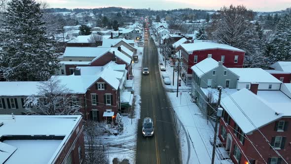 Christmas snow. Rooftop view during snow flurries. Aerial above street. Santa about to enter rooftop