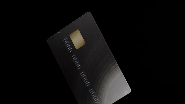 Credit Plastic Card Turning Spinning Isolated on Black Background Business Financial Operations