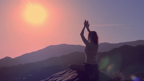 Young Practicing Woman Practice Yoga on Mountain Peak