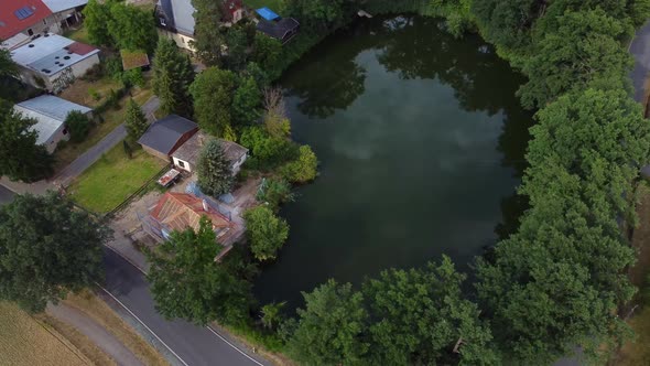 Own Carp fish farm in a lake on the doorstep.Gorgeous aerial view flight panorama curve flight dron