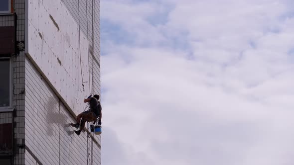 Industrial Climber Insulation of Facade Old High-Rise Building Using Styrofoam