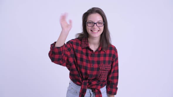 Happy Young Beautiful Hipster Woman Waving Hand
