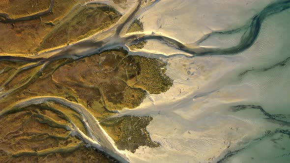 Overhead truck left view of the vein-like formations at the mouth of the Rio Blanco in the Pacific O